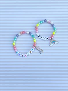 Adorable kids beaded bracelet with 6mm pastel iridescent rainbow beads with your choice of name/lettering and charm. Charms available currently are shooting star and rainbow. So cute and the charm adds such a unique look to your little one's bracelet! Makes a great gift as well- everyone loves something personalized! Please provide the following information in the personalization field: -Name/word you would like -Heart color (if any)- red, orange, yellow, green, blue, purple, pink, black or gold Playful Personalized Adjustable Charm Bracelet, Cute Personalized Multicolor Beaded Bracelets, Cute Personalized Friendship Bracelets With Round Beads, Cute Name Bracelet With Letter Beads, Playful Multicolor Personalized Charm Bracelet, Personalized Rainbow Beaded Bracelets For Birthday, Personalized Rainbow Beaded Bracelet For Birthday, Personalized Playful Beaded Bracelets, Birthday Charm Bracelet With Letter Beads And Round Beads