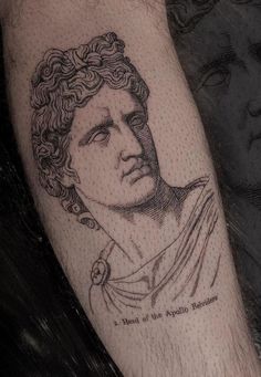 a man's arm with a portrait tattoo on it