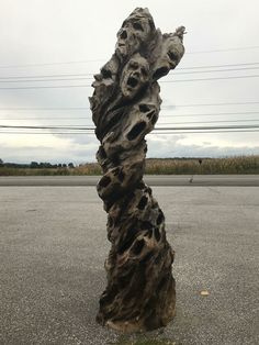 a large piece of wood sitting in the middle of a parking lot