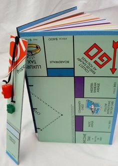 an open book with instructions on how to use the game monopoly in russian and english