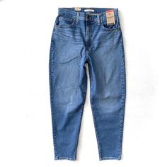 This Listing Is For Levi's Jeans. They Are New With The Tag. High Waisted High Rise Tapered Leg 85% Cotton, 14% Polyester, And 1% Elastane Size: 31x29 Waist: 31" Rise: 13" Inseam: 29" High Waisted Mom Jeans, Levi's Jeans, Levis Jeans, High Jeans, Tapered Legs, Mom Jeans, Levi's, High Rise, Women Jeans