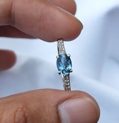 Aquamarine East-West Ring, Dark Aquamarine Oval Ring in 925 sterling silver, 6×4mm Aquamarine Ring with Moissanite Band for her Materials: 925 sterling silver, Natural Dark Santa Maria Aquamarine Aquamarine Size : 6×4mm Moissanites : 1.5mm Rounds. O U R P R O M I S E + + + + + + + + + + + + + We believe that it is the importance to ensure that our each and every customer are satisfied with what they bought from us. Till now each and every sales we made we keep our customer satisfied as our customers near and dear to our hearts and sure your shopping experience is unforgettable We work with precision. Emotion that brings sweet smile in your face. Emotion that shows togetherness in each and every part of the . We are a team of dedicated professionals who use to work with precision, creating Oval Moissanite Topaz Ring In Fine Jewelry Style, Oval Topaz Ring With Moissanite For Anniversary, Moissanite Band, In Your Face, Flower Girl Gifts, Aquamarine Ring, R P, Oval Ring, Oval Rings