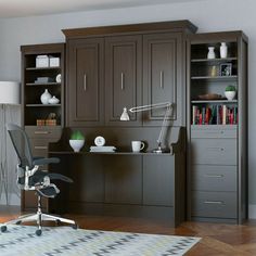 an office with a desk, chair and bookcase