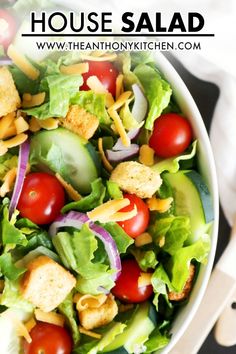 a white bowl filled with salad on top of a table