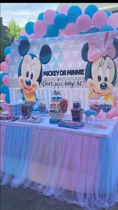 mickey and minnie mouse dessert table with balloons