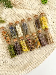 small bottles filled with different types of herbs