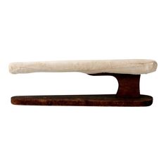 an old wooden handle with a white cloth on it's end, against a white background