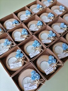 a box filled with lots of blue flowers next to each other on top of a table