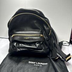 Leather Backpack In Very Good Condition No Visible Callouts. This Backpack Is Adorable, Soft Leather Black With Gold Hardware. Comes With Dust Bag And Cards. Saint Laurent Bags, Saint Laurent Bag, Leather Backpack, Gold Hardware, Soft Leather, Saint Laurent, Dust Bag, Bag Lady, Backpacks