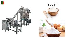 sugar making machine with wooden bowl and spoon next to it's packaging process, including sugar