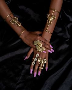 Enhance any look with this distinctive African-inspired jewelry set. Crafted by skilled artisans in Kenya, it includes a 2x elephant bracelets, 1 triple cowry shell ring , one Africa statement ring, and one elephant ring, all made from brass. Bohemian Hand-wrapped Metal Jewelry, Spiritual Jewelry With Unique Design And Adjustable Fit, Spiritual Jewelry With Unique Adjustable Design, Gold Hand Wrapped Jewelry For The Beach, Beach Toe Ring Jewelry, Beach Gold Hand Wrapped Jewelry, Unique Hand-wrapped Bangle Jewelry, Unique Design Metal Jewelry For Festivals, Spiritual Metal Jewelry With Unique Design