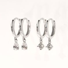 These 14K White Gold Small Hoop earrings will be your favorite earrings for the wedding day and everyday after. 14K White Gold Moissanite Crystals Hypoallergenic, lead and nickel free Thickness 1.8mm Diameter Sizes: Inside 8.2mm Stone Diameter: 3mm Click Snap closure #ES055-WG Second Piercings, Gold Small Hoop Earrings, 14k Gold Hoop Earrings, Second Piercing, Minimal Earrings, Small Hoop Earrings, Huggie Earrings, Gold Collection, Hoop Earrings Small