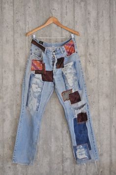 Ready to send:Size-LEE size 32,33,34Unique vintage jeans with apcycled patches.One of a kind..Hand made embroidery and unique painting ....---Or----Made to order,  in any size, within 4 working days . If you need different size, please send me a message and I will make you a special and unique design within 2 working days.They are all different! No one will have the same one as you have! Hand painted, one of kind jeans.You pick your size, model (slime- boyfriend- high waist- low waist) and prime Festival Denim Jeans With Patches, Bohemian Denim Jeans With Patches, Bohemian Blue Jeans With Patches, Blue Bohemian Jeans With Patches, Vintage Denim Jeans With Collage Stitching, Vintage Jeans With Collage Stitching, Blue Bohemian Reworked Jeans, Bohemian Reworked Denim Jeans, Patch Holes In Jeans