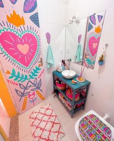 a colorful bathroom with an open toilet and sink