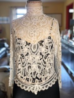 "The workmanship on this blouse is extraordinary.  It's made of battenburg lace and comes from the 1910s. These kinds of blouses are all hand stitched and would have taken months to make.  They were made to measure with no seams.  The front waist area is gathered to give a slight pidgeon shape to it. High neck collar and Irish crochet lace inserts throughout. This is in wonderful condition.   The rear hooks or press studs are missing.  You could put buttons or hooks and eyes.  Whatever closure y Crochet Lace Blouse, Battenburg Lace, White Lace Blouse, Irish Lace Crochet, Lace Outfit, Linens And Lace, Antique Clothing, Irish Lace, Edwardian Fashion