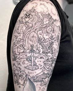 a man's half sleeve with an image of a castle and trees on it