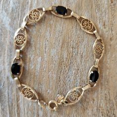 Vintage Gold Filled Fancy Link Onyx Bracelet | Gold-filled Bracelet | Onyx Presenting a gorgeous estate find. What a wonderful bracelet! This is marked for 12k gold filled, Binder Bros. Inc. New York NY. Binders Bros. era is c.1922-1950.   DETAILS: Gemstones: 6x8 mm each x 3 = approx. 3ctw Length of bracelet - approx 7.25"  Stamps: BB 1/2012kGold Filled Condition: Very good commensurate with age. Clasp works well. Your item will arrive beautifully gift-boxed. Layaway is available. Click the tab above for shop policies, or if you are on a mobile device, scroll down in the shop to read our policies and frequently asked questions.  Connect with Us: INSTAGRAM: https://www.instagram.com/cypresscreekvintage FACEBOOK: https://www.facebook.com/CypressCreekVintage PINTEREST: https://www.pinterest.c Onyx Bracelet, Bracelet Gold, Chain Link Bracelet, Link Bracelets, Vintage Gold, Chain Link, Gold Filled, Onyx, Gold Bracelet