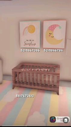 there is a baby crib in the room with two pictures on the wall behind it