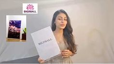 a woman holding up a box with the words birnall on it and an image of