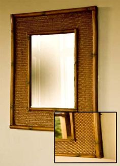 a mirror hanging on the side of a wall