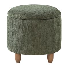 a green ottoman with wooden legs