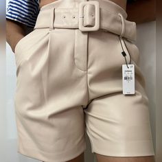 These Pull+On Faux Leather Belted Bermuda Shorts Are The Perfect Pick.Pair With A Matching Bodysuit,Tee,Or Blouse For An Edgy Yet Stylish Look Women's Shorts, Color Neutral Size 2 And Size 0 In Beach Color Beige Belted Shorts Outfit, Beach Color, Faux Leather Belts, Belted Shorts, Women's Shorts, Bermuda Shorts, Size 2, Faux Leather, High Waisted