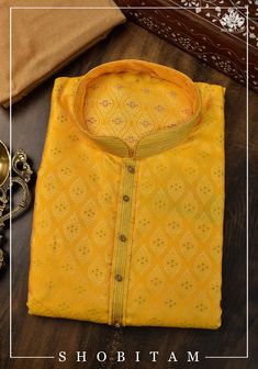 Item: Yellow with Sandalwood Pajama Detailing around the neckline and sleeves is done. No Lining. Any celebration gets sweeter when it is done in 'Desi' style! Blending the best of tradition, trend, style, ease, and comfort, our men's line comes in elegant hues that can brighten any occasion. You can wear this Kurta with the Pajama that it comes with or sport a casual Indo-Western look by pairing it over jeans! This Kurta in multiple sizes, please refer to the size chart below for actual measure Luxury Yellow Jamawar Kurta, Mustard Straight Kurta For Diwali, Yellow Sherwani For Puja And Eid, Yellow Sherwani For Eid Puja, Traditional Yellow Kurta With Self Design, Mustard Kurta With Zari Work For Diwali, Yellow Kurta For Puja, Yellow Self Design Kurta For Puja, Traditional Mustard Kurta For Festive Occasions