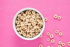 cereal in a bowl on a pink background