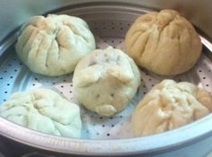 four doughnuts are sitting in a pot on the stove