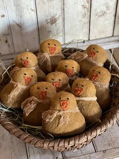 a basket filled with small stuffed animals sitting on top of a wooden table