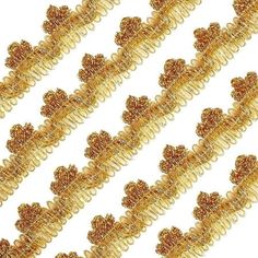 some gold colored beads on a white background