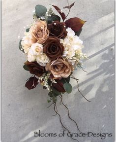 a bridal bouquet with white and brown flowers