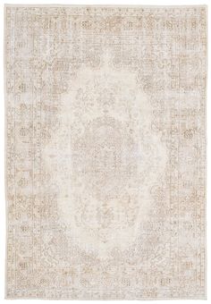 an antique rug with a medallion design in beige and cream colors on a white background