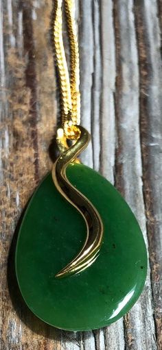 Beautiful teardrop shape jade pendant in gold-tone setting. The genuine Canadian nephrite jade stone measures 27mm long. Add it to your favorite gold chain for a stunning look! A Grade Canadian Nephrite Jade All of our Jade is 100% natural. 30 day satisfaction guarantee! Jade is a natural stone, so the shade of color may vary slightly. All of our jade is grade A, unless otherwise noted. It is 100% Pure Nephrite Jade, with no treatments whatsoever. What is Jade? Jade is one of two gemstones, nephrite jade or jadeite jade. Nephrite jade , (a silicate of calcium and magnesium), is the historical Chinese Jade, or Stone of Heaven, a stone revered by the Chinese for more than 5000 years. Nephrite is prized for its special qualities: its extreme toughness, (the toughest of any natural stone), its Gold Teardrop Jade Jewelry, Chinese Jade, Nephrite Jade, Teardrop Pendant, Jade Jewelry, Magnetic Bracelet, Natural Jade, Jade Stone, Jade Pendant