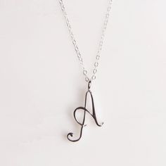 "Letter A Initial Necklace - Cursive \"A\" initial silver pendant - Personalized initial silver pendant for women / Gift for her / for mom Dainty \"A\" initial. Perfect every day necklace. Lovely gift for your self, sister, bridesmaids, new mom. Convo me if you would like to customize the length of the chain. The possibilities are endless. Pendant: Base metal is brass and 16K gold plated. Chain is 18 inches, sterling silver. (if you would like a longer or shorter chain, please contact us to cust Silver Minimalist Personalized Initial Necklace, Minimalist Silver Initial Necklace For Anniversary, Dainty Silver Necklaces With Initials, Minimalist Silver Monogram Necklace, Sterling Silver Initial Pendant Charm Necklace For Mom, Silver Initials Necklace For Everyday, Hypoallergenic Initial Pendant Charm Necklaces For Mother's Day, Hypoallergenic Initial Pendant Charm Necklace, Silver Minimalist Necklace With Initials