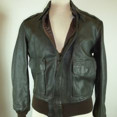 Genuine Leather Type A 2 Flight Jacket..Made In The Usa..Size 40 R(These Run Small So Please Use Measurements..Made By Flight Suits In El Cajon..Fully Lined..Scovill Zipper...Knit Cuffs And Hem....Snap Pockets With Flaps...Overall This Is In Fabulous Condition..One Small Flaw On The Knit At The Hem(Repaired)... Measures Length 26 Underarm To Underarm 22 Shoulder 18 Sleeve 25 Fitted Military Brown Outerwear, Flight Suits, Flying Jacket, Aviator Jacket, Aviator Jackets, Vintage Type, Flight Jacket, Type A, Knit Cuff