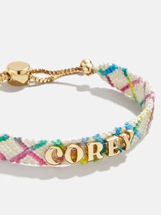 Our Criss Cross Custom Woven Friendship Bracelet offers an updated take on the ever-loved friendship bracelet trend. Colorful woven thread creates a criss cross patterned backdrop for graphic gold letter beads. Each letter is sewn on by hand for this bracelet. Pick up one for you and a friend, then choose to add your name, initials, or a favorite phrase. See our Letter Key for all options available. Please note: due to their handmade nature, each bracelet will be slightly unique. Name Necklace For Kids, 2024 Christmas Gift Trends, Bday Gifts For Bf, Best Friends Christmas Gifts, Christmas Gifts For Your Best Friend, Grad Gifts For Best Friends, Cute Birthday Gifts For Best Friend, Adult Friendship Bracelets, Pickleball Bracelet