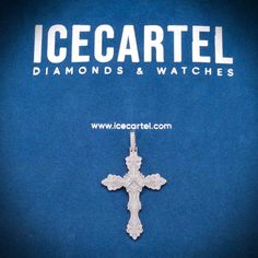 an icecartel diamond cross pendant on a blue background