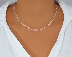 Paperclip Chain Necklace, Sterling Silver Rectangle Link Necklace, Delicate Large Link Choker Sterling silver minimalist Paperclip Link Chain Necklace adds a stylish touch to your look. It is absolutely versatile. You can adjust the length along the links to change it up depending on your mood or outfit, or You could also try wearing it as a wrap round bracelet and anklet. Perfect present to the ones you love if you beet the temptation to leave it for yourself. ⭐️ Details Sterling Silver Link si Modern White Chain Necklace For Everyday, Minimalist Chain Necklace With Rectangular Pendant, Everyday Silver Rectangular Chain Necklace, Everyday Rectangular Silver Chain Necklace, Silver Rectangular Delicate Chain Necklace, Silver Chain Necklace With Delicate Rectangular Pendant, Minimalist White Silver Chain Necklace, Silver Delicate Chain Rectangular Necklace, Minimalist White Box Chain Necklace