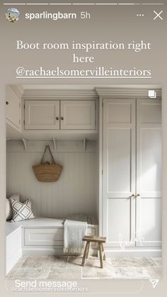 a room with white cabinets and a bench