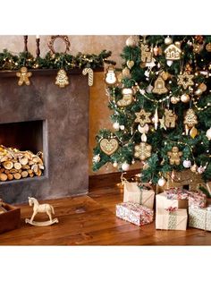 a decorated christmas tree in front of a fire place with presents and ornaments on it