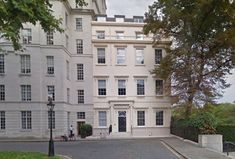 a large white building with lots of windows