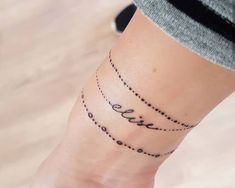 a woman's foot with the word love written in small letters on her ankle