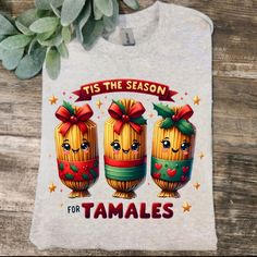 a white shirt that says tis the season for tamales with three cartoon characters on it