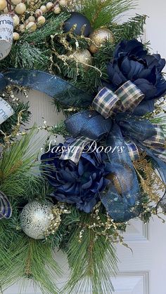 a christmas wreath with blue and gold decorations