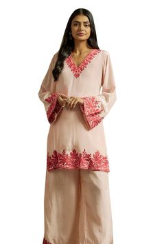 Peach kurta embroidered with kashmiri aari embroidery. Paired with a flared pant with matching embroidered hem. - Aza Fashions Traditional V-neck Semi-stitched Salwar Kameez, Traditional Unstitched V-neck Kurta, Unstitched V-neck Sets With Resham Embroidery, Semi-stitched Traditional Wear With V-neck, Semi-stitched V-neck Kurta, Semi-stitched Traditional V-neck Wear, Traditional Semi-stitched V-neck Wear, Traditional V-neck Set With Resham Embroidery, Traditional V-neck Sets With Resham Embroidery