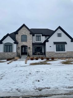 a large house with snow on the ground