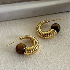 Material quality: metalTreatment process: electroplating Trendy Metal Earrings With Plating, Trendy Metal Plated Hoop Earrings, Brown Metal Hoop Earrings, Brown Metal Hoop Jewelry, Stone Hoop Earrings, Geometric Texture, Geometric Hoop Earrings, Geometric Textures, Brown Stone