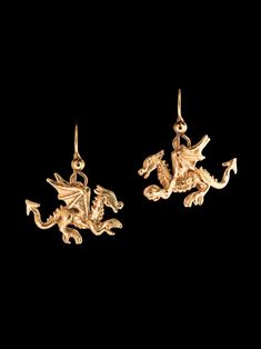 Don't be fooled by their diminutive size, our Tiny Welsh Dragon Earrings posses powerful spirits! These highly detailed and high stepping dragons are cast in 14K gold and are 7/8" long and 5/8" high not including the length of the ear wires. They are completely solid and three dimensional.  All Marty Magic Jewelry is packaged in a beautiful box, embossed with the gold foil Marty Magic dragon logo. Perfect for any occasion! Designed in Santa Cruz California by Marty Magic. . Symbolic Yellow Gold Jewelry For Pierced Ears, Nickel Free Yellow Gold Jewelry For Collectors, Collectible Yellow Gold Drop Earrings, Symbolic Yellow Gold Pierced Earrings, Symbolic Yellow Gold Sterling Silver Earrings, Symbolic Yellow Gold Jewelry With Matching Earrings, Symbolic Nickel-free Yellow Gold Earrings, Elaena Targaryen, Targaryen House