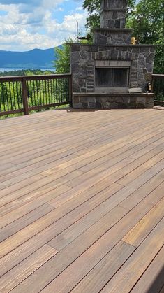 a fire place sitting on top of a wooden deck